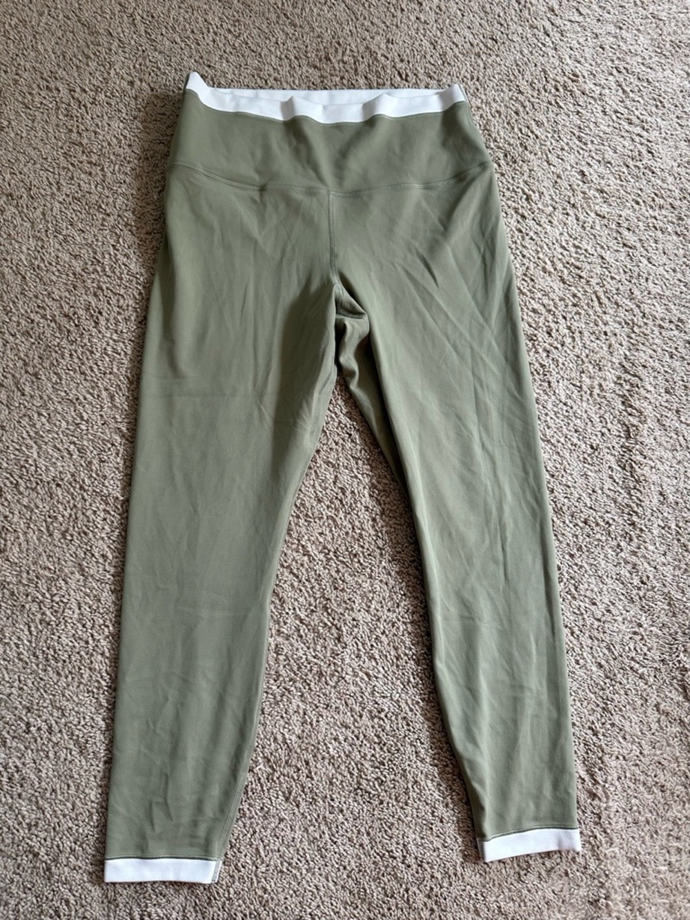 Athleta Olive Green Active Leggings with White Trim.